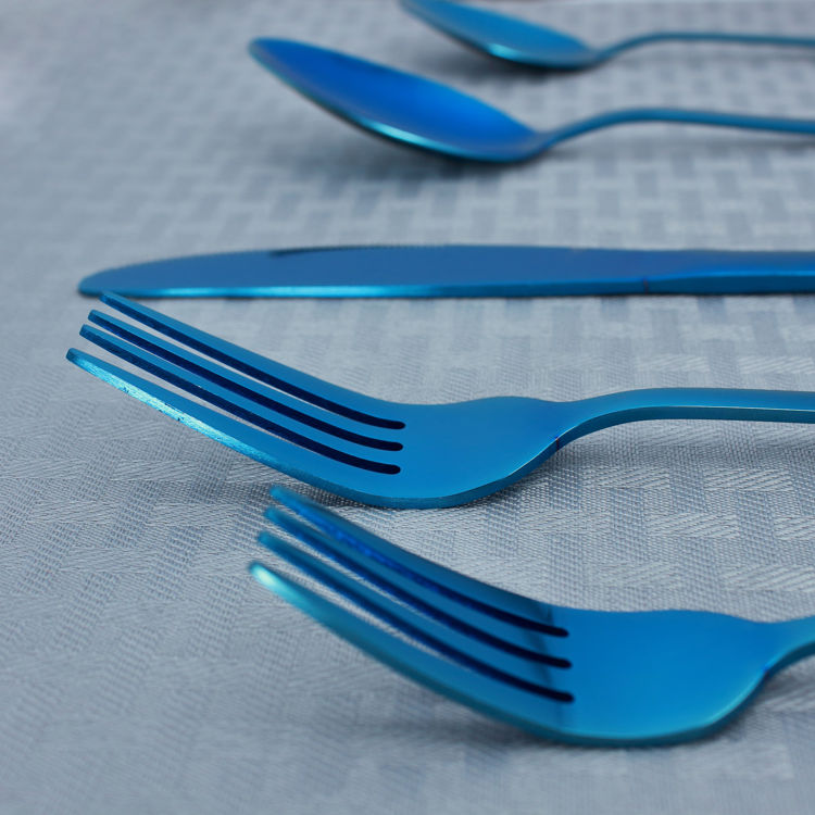 Reflective blue flatware - cutlery - stainless steel - closeup